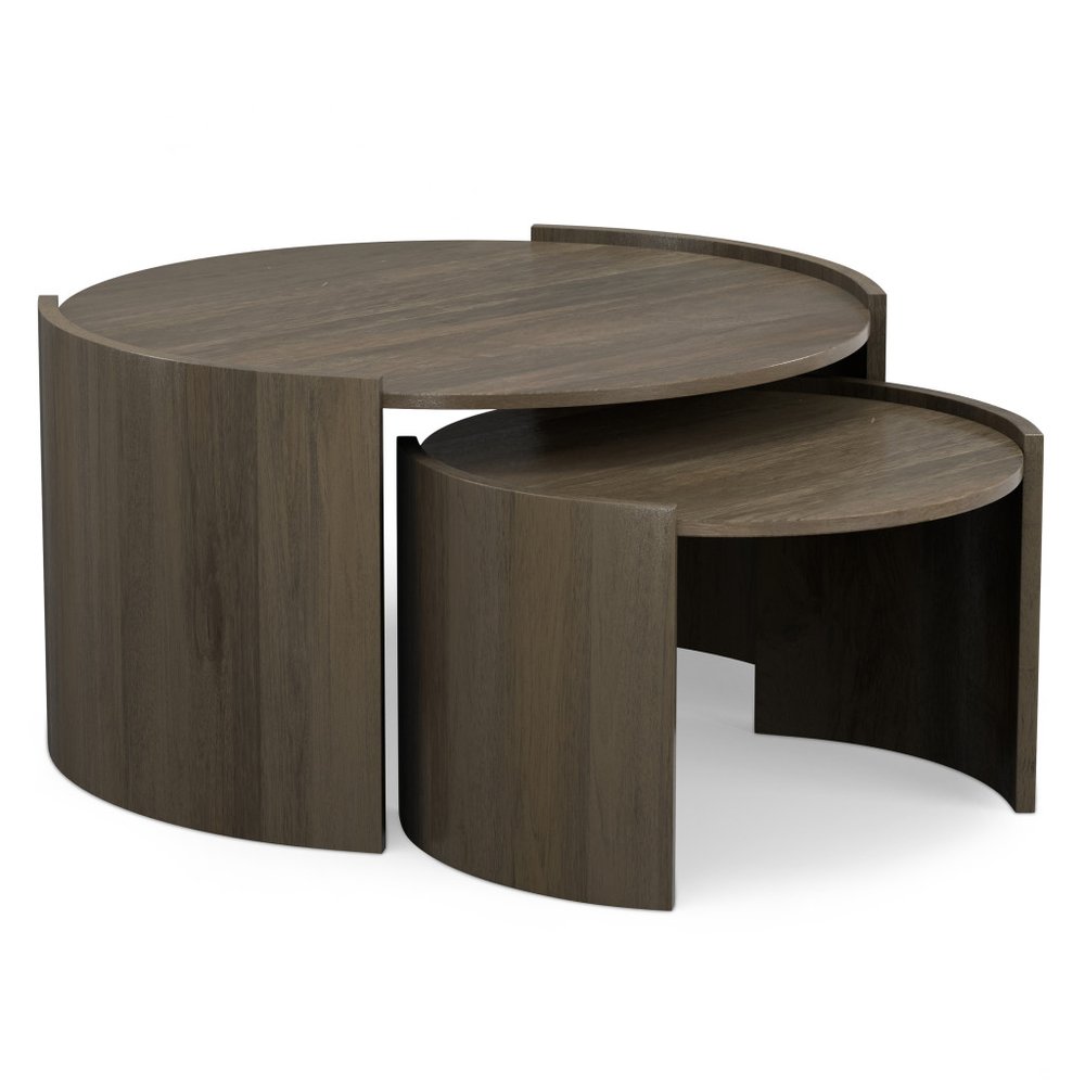 Set of two ash gray solid wood round nested coffee tables on a white background.