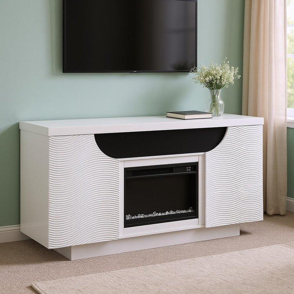 66" White Ribbed Wood Electric Storage Cabinet Fireplace With LED And Speaker styled in a furnished interior with a black wall on a blush floor.