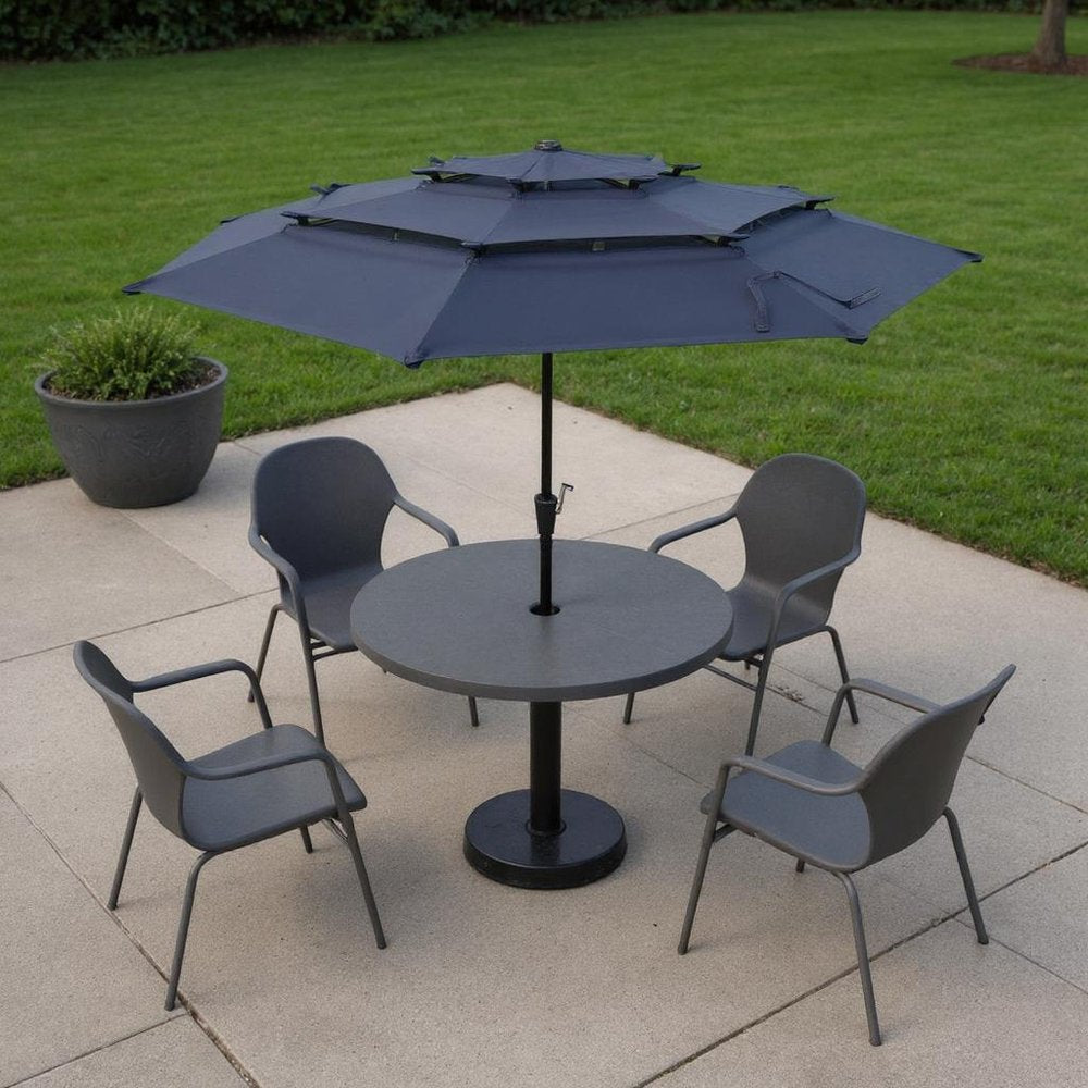 10' Dark Blue Polyester Octagonal Tilt Lighted Market Patio Umbrella shown outdoors on a patio with greenery.