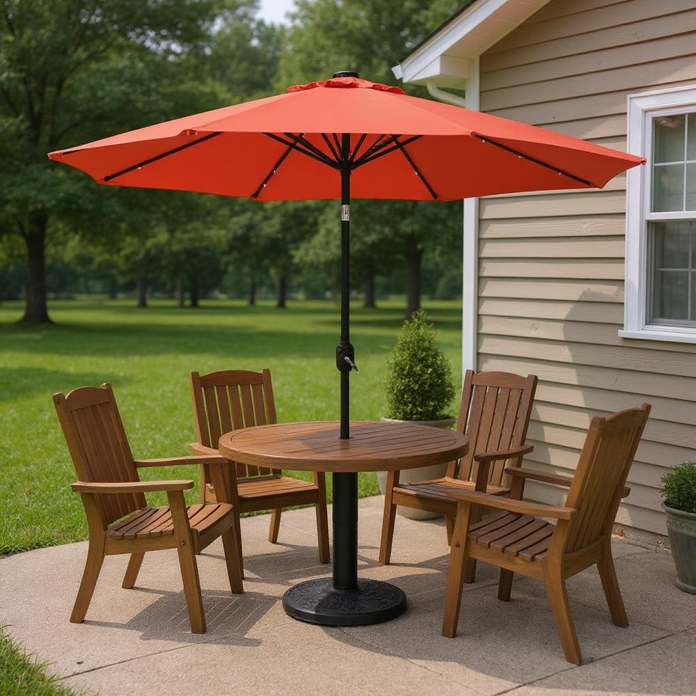 9' Orange Polyester Octagonal Tilt Lighted Market Patio Umbrella in a home interior
