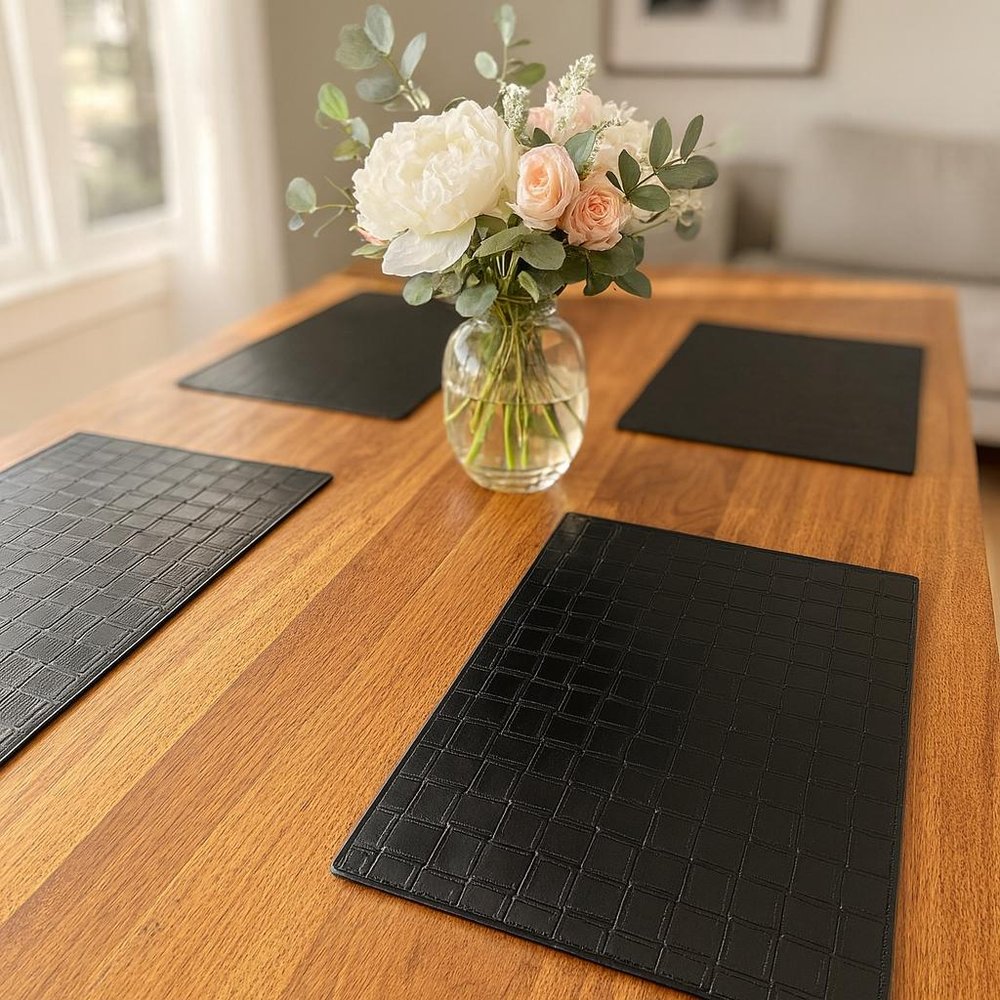 18" Set of Four Black Basketweave Faux Leather Placemats. Dining linen in black faux leather.