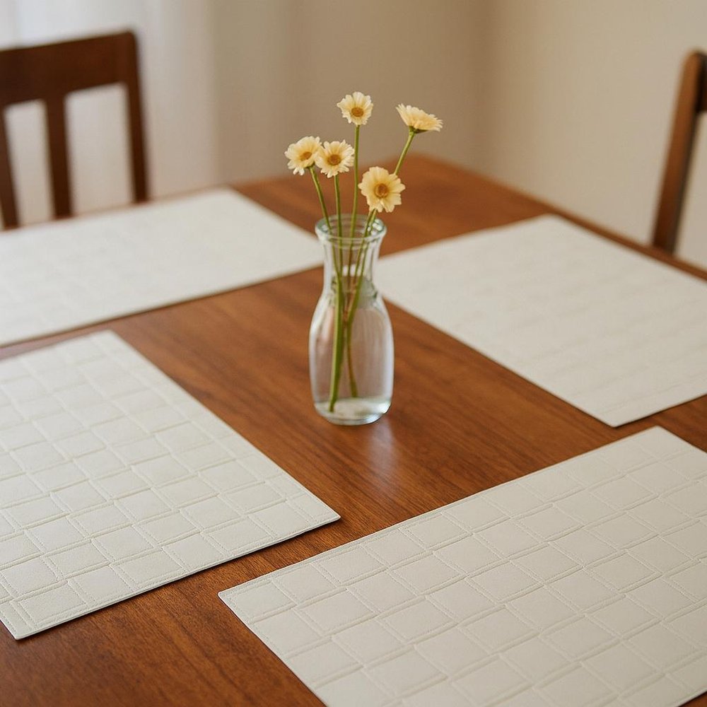18" Set of Four White Basketweave Faux Leather Placemats. Dining linen in white faux leather.