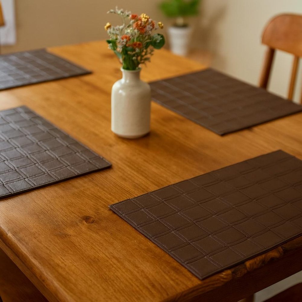 18" Set of Four Espresso Basketweave Faux Leather Placemats. Dining linen in dark brown faux leather.