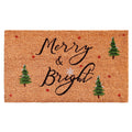 Brown coir doormat with "Merry & Bright" text, snowflakes, Christmas trees, and red stars.