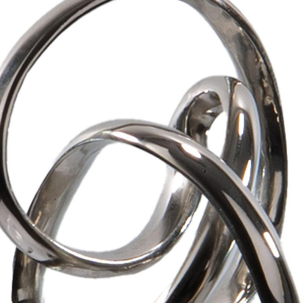 20" Silver And Black Aluminum And Marble Modern Abstract Tabletop Sculpture. Sculpture isolated on a plain white background, showing a silver metal surface.