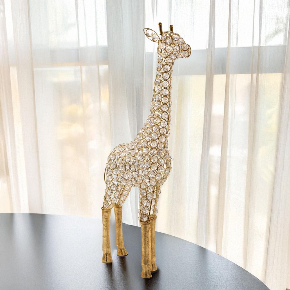 23" Gold Aluminum And Faux Crystal Giraffe Tabletop Sculpture. Sculpture isolated on a plain white background, showing a crystal surface.