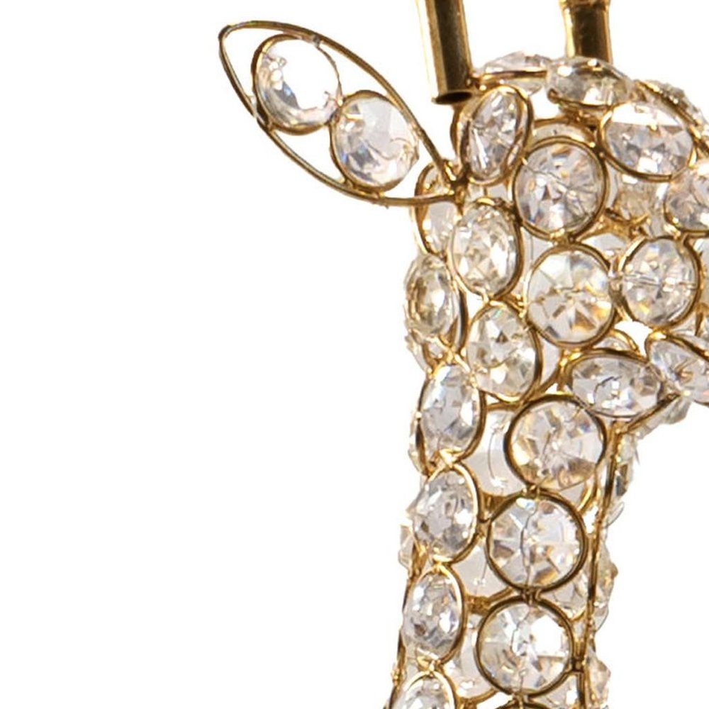 23" Gold Aluminum And Faux Crystal Giraffe Tabletop Sculpture. Sculpture isolated on a plain white background, in a gold crystal finish.