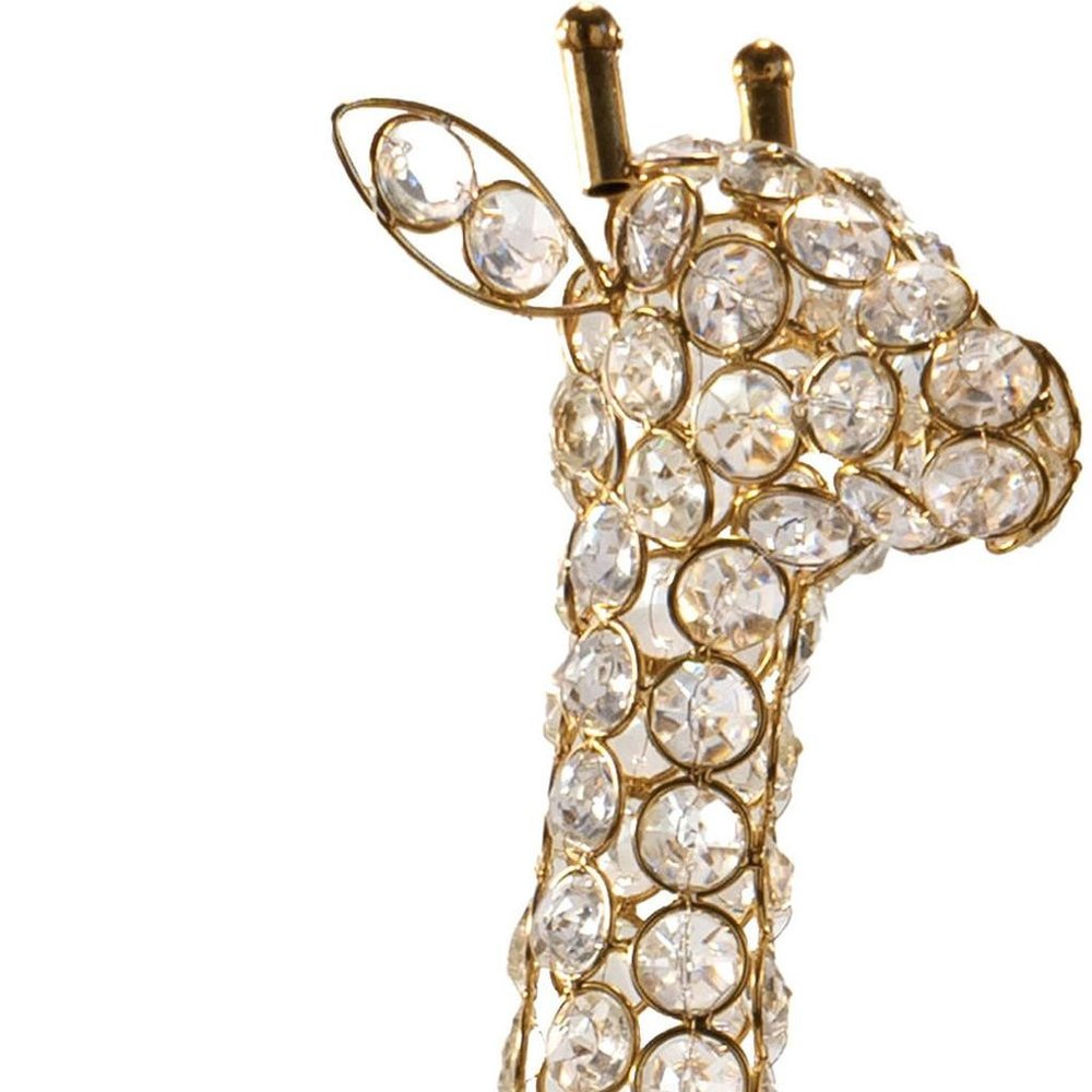 23" Gold Aluminum And Faux Crystal Giraffe Tabletop Sculpture. Sculpture isolated on a plain white background, showing a gold crystal surface.