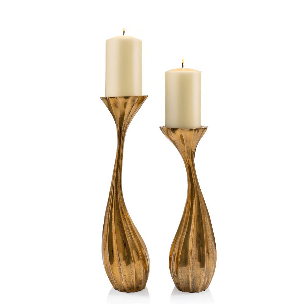 Set of Two Antiqued Gold Aluminum Wavy Faceted Tabletop Pillar Candle Holders on a white background