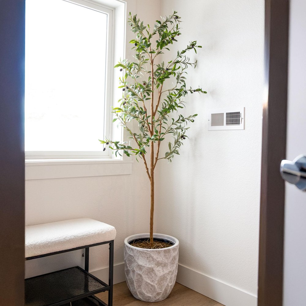 72" Green Olive Artificial Tree in a Black Pot in a home interior