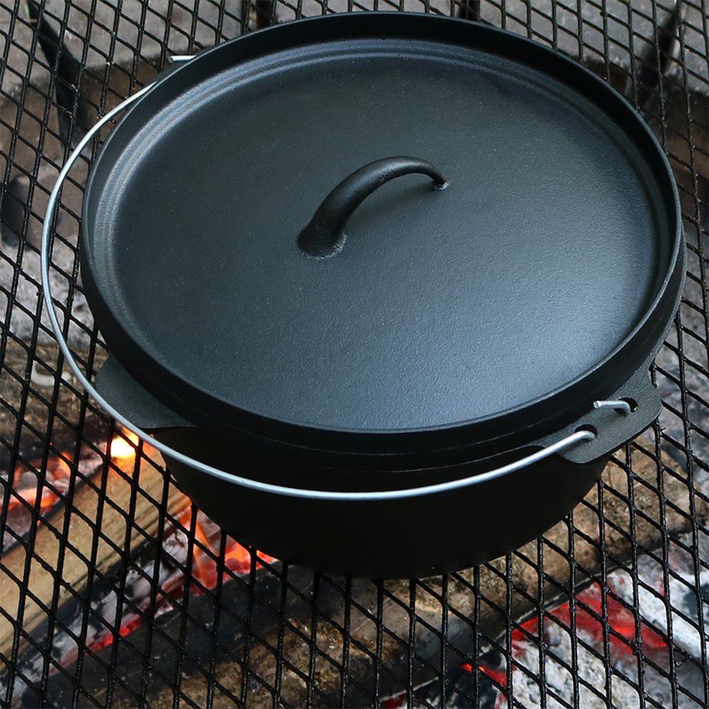 12" Black Cast Iron Dutch Oven Stock Pot photographed against a dark studio background in black.