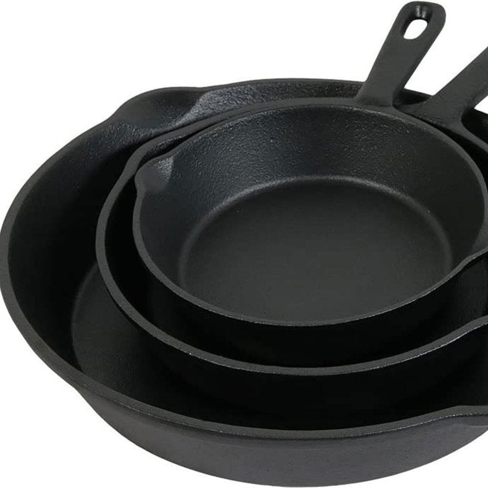 Set of Three Black Cast Iron Frying Pans on a white background