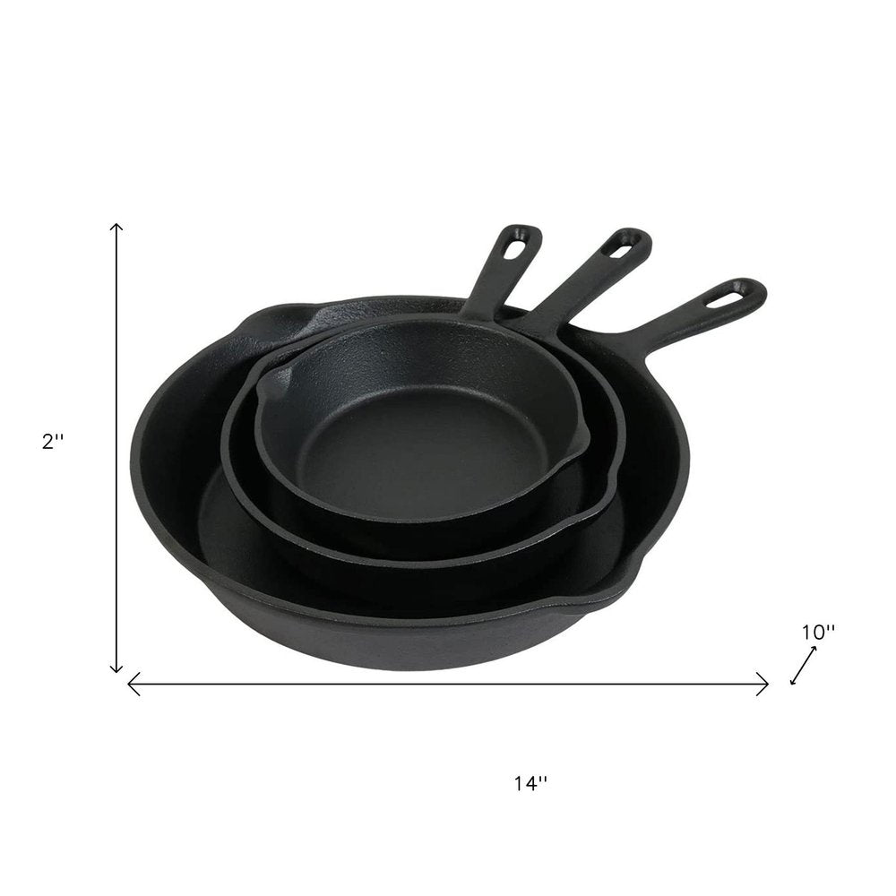 Set of Three Black Cast Iron Frying Pans on a white background