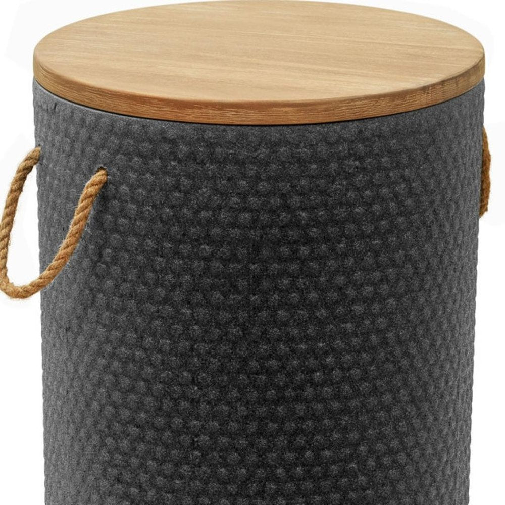 Round side table with a textured dark gray base and a natural wood top, featuring rope handles.