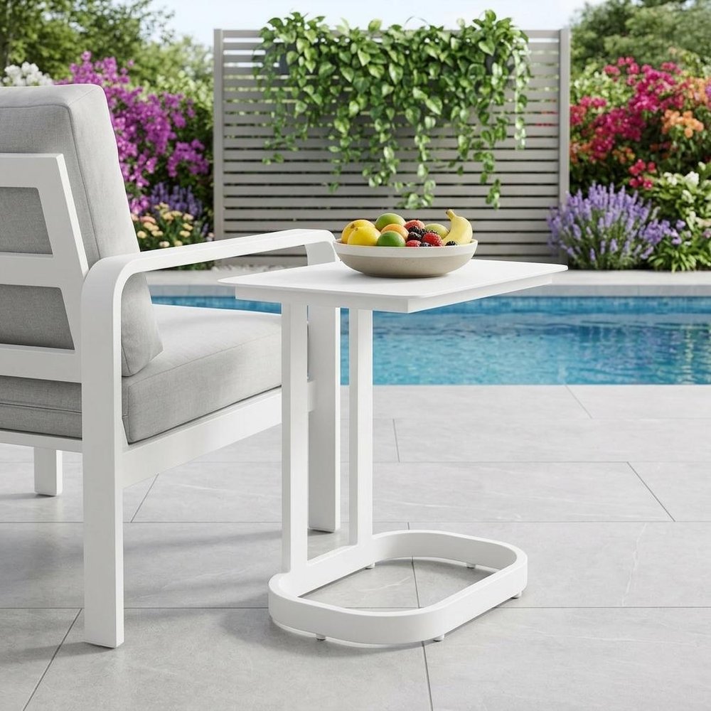 22" White Aluminum Outdoor Side Table shown outdoors on a tiled patio with greenery.