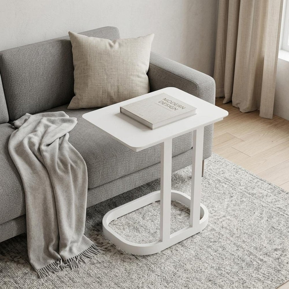 22" White Aluminum Outdoor Side Table styled in a furnished interior with a light gray wall on a tiled floor.