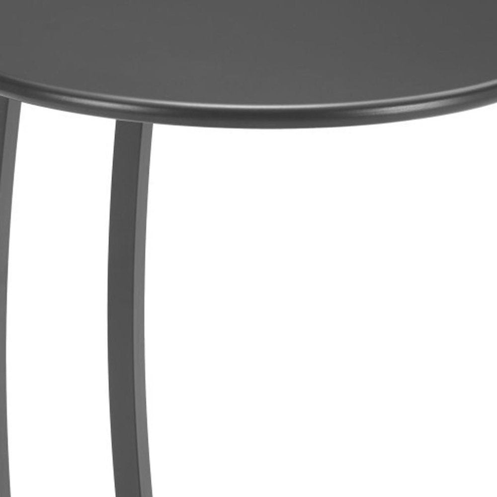 Close-up of a black aluminum round outdoor side table with curved legs against a white background.