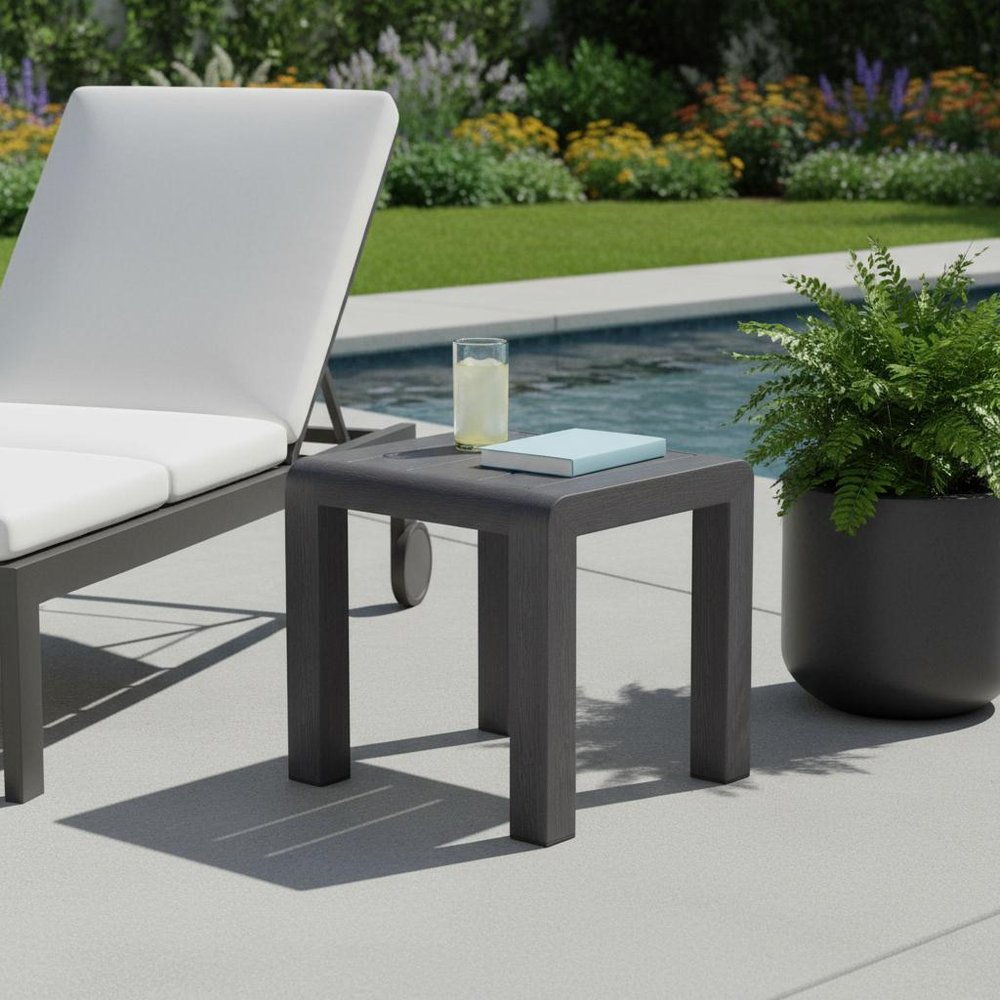 23" Black Aluminum Square Outdoor Side Table shown outdoors on a tiled patio with greenery.