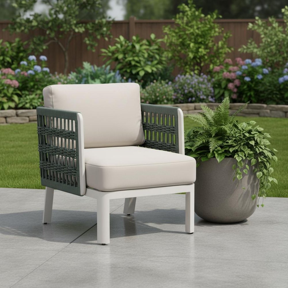 27" Green And White Aluminum Outdoor Accent Chair with White Cushion shown outdoors on a tiled patio with greenery.