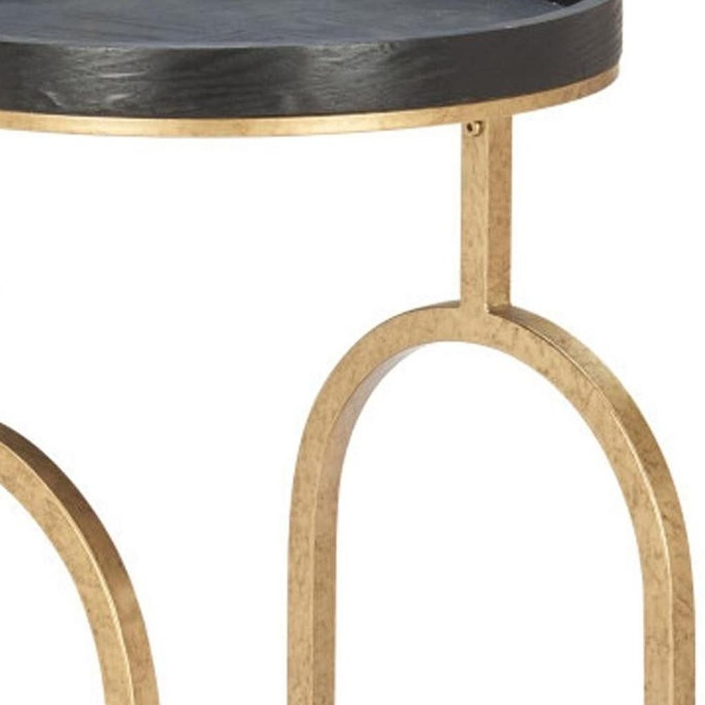 17" Black And Brass Steel and Solid Wood Distressed Round Rolling Bar Cart. Bar cart isolated on a plain white background, finished in black wood.