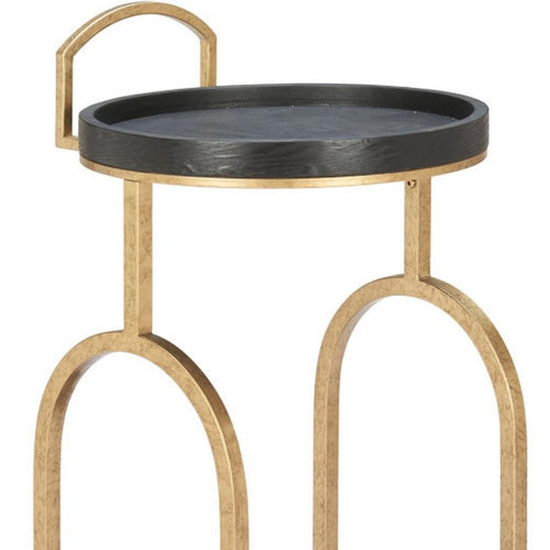 Round black and brass steel and solid wood distressed bar cart with arched legs on a white background.