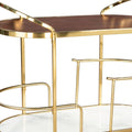 32" Brown Gold And White Iron Solid Wood and Marble Oval Rolling Bar Cart. Bar cart isolated on a plain white background, showing a gold wood surface.