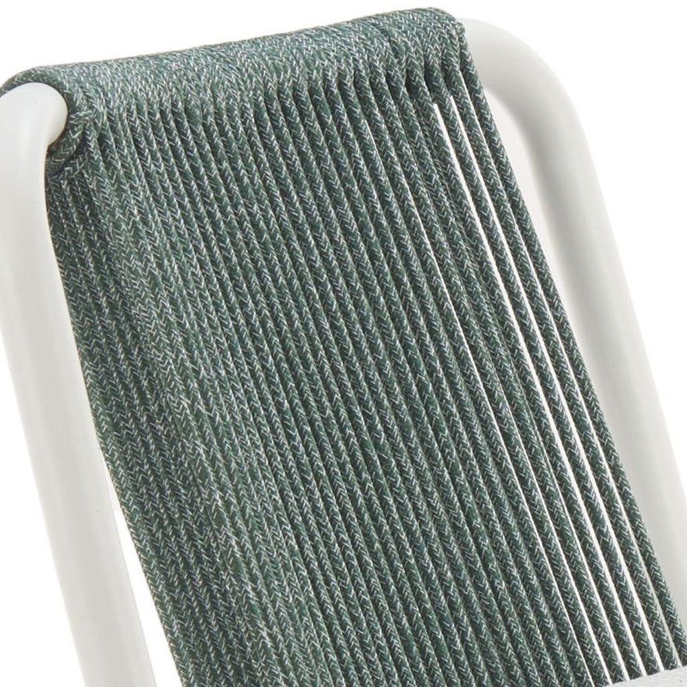 Close-up of a white and green woven chair back with a white frame, showing the texture of the woven material.