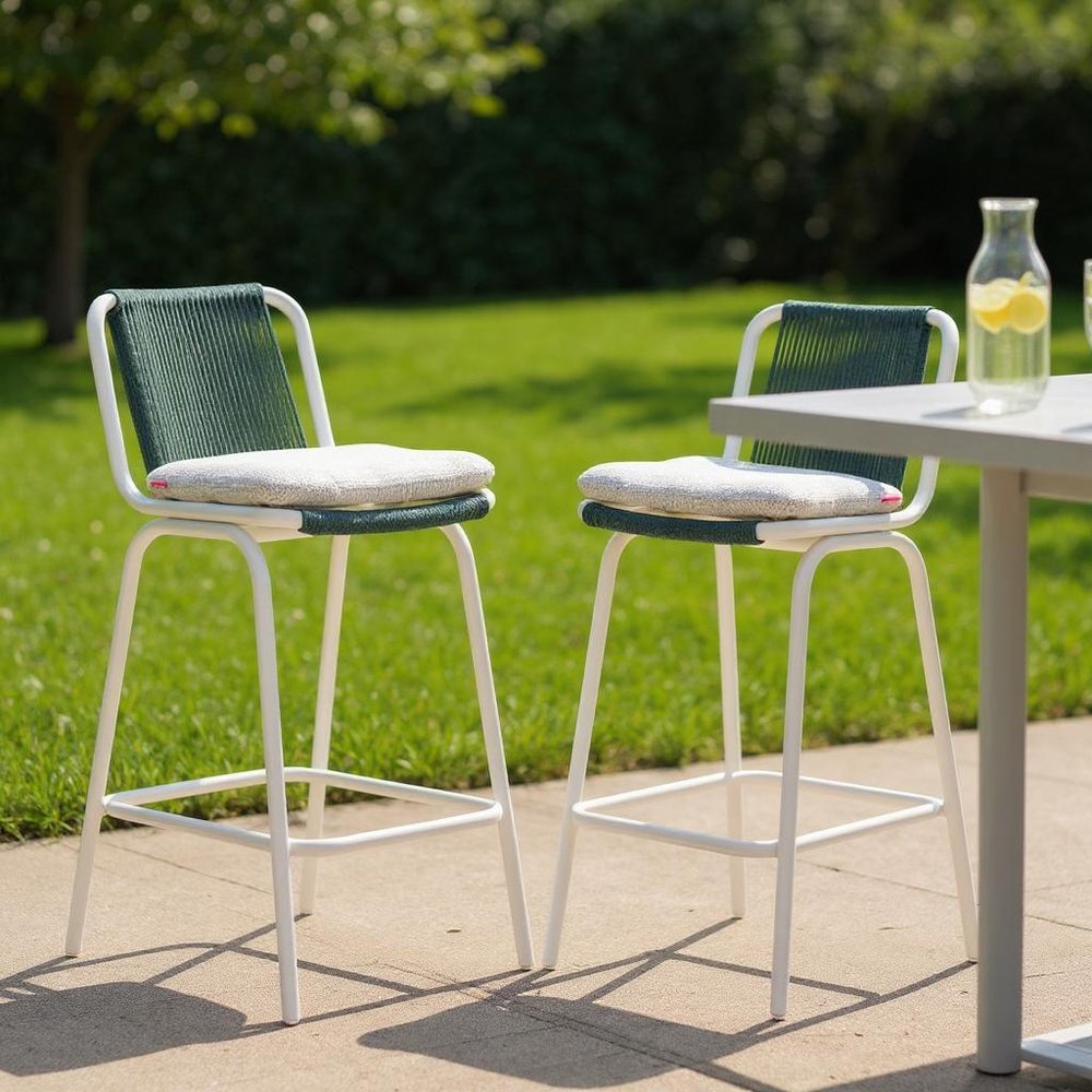 Set of Two White and Green Woven Back And Aluminum Counter Height Bar Chairs in a home interior