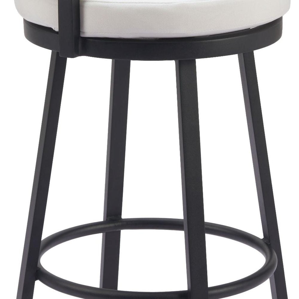 Black metal bar stool with a white upholstered seat and a circular footrest against a white background.