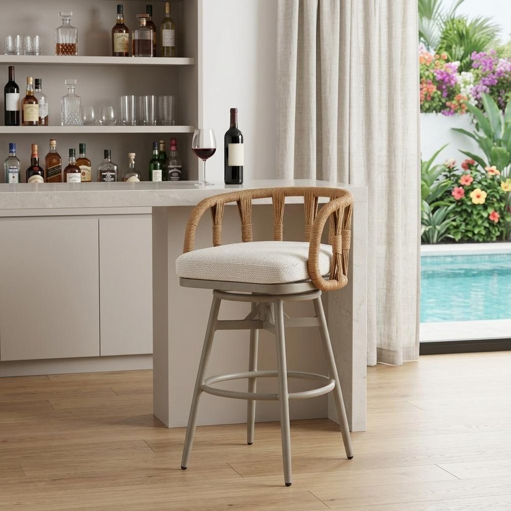 30" Gray Natural and White Aluminum And Faux Rattan Swivel Bar Height Chair shown outdoors on a patio.