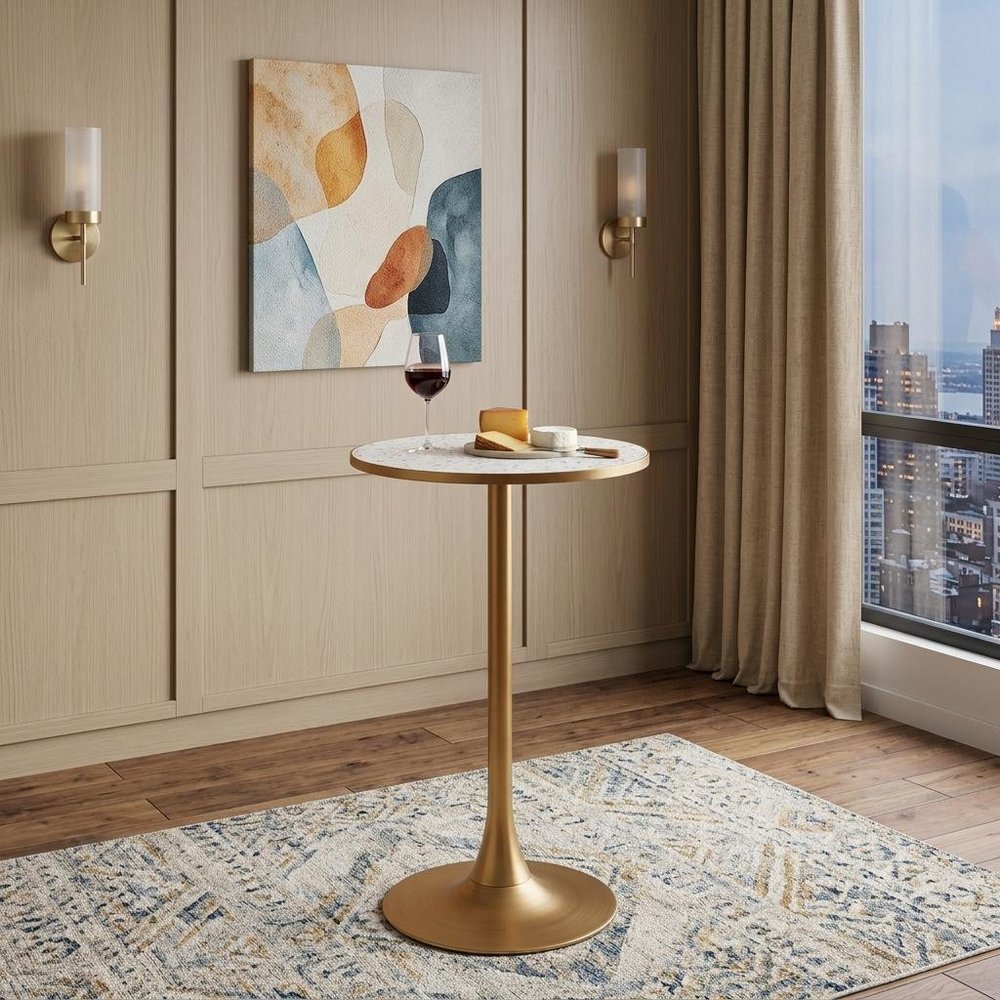 24" Beige and Gold Faux Terrazzo and Steel Rounded Bar Table shown outdoors on a tiled patio.