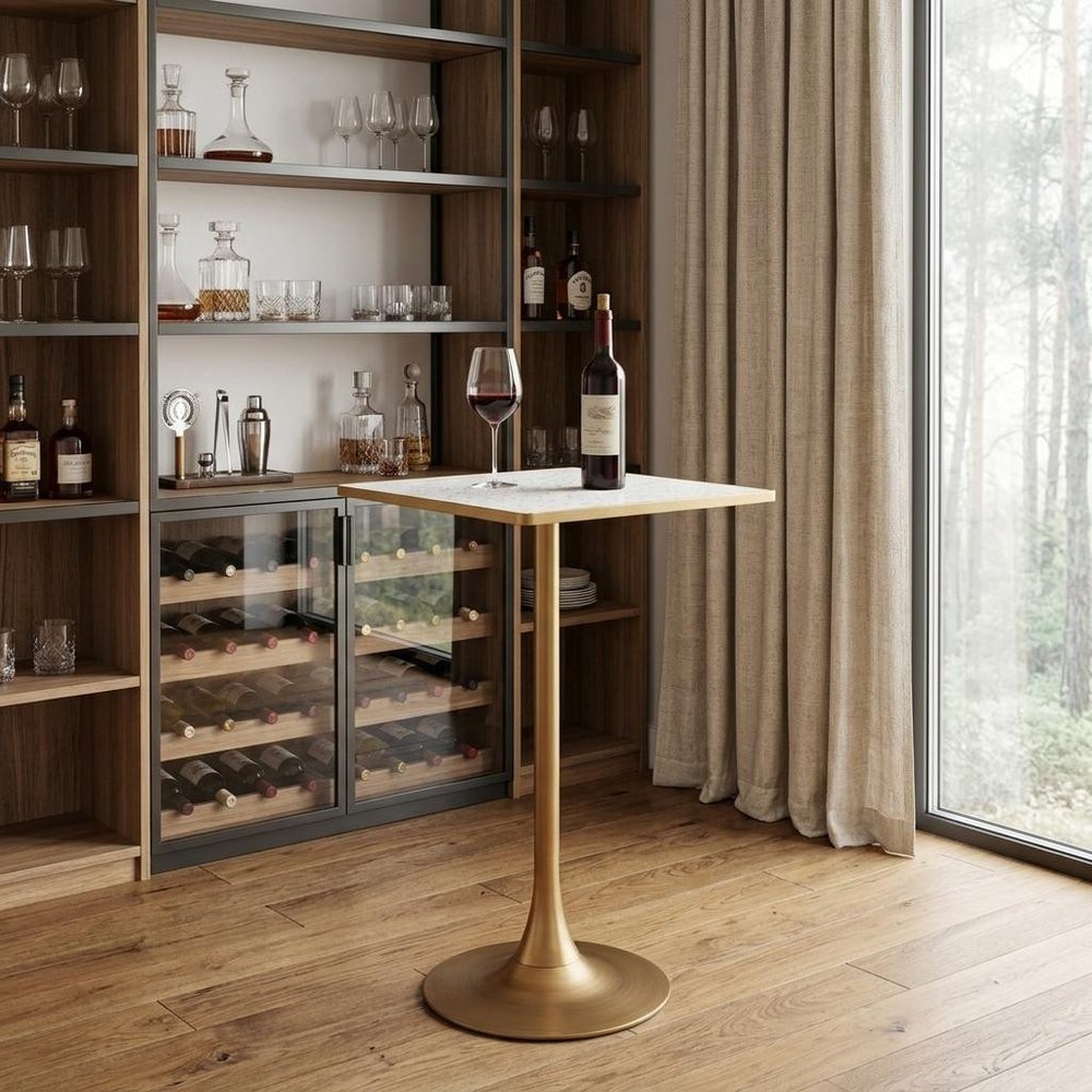 24" Beige and Gold Faux Terrazzo and Steel Square Bar Table styled in a furnished interior with a dark brown wall on a wood floor.