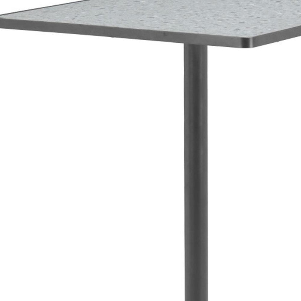 Square bar table with gray faux terrazzo top and black steel pedestal base against a white background.