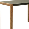 56" Gray And Natural Faux Concrete And Solid Wood Outdoor Bar Table. Outdoor table isolated on a plain white background, finished in tan wood.