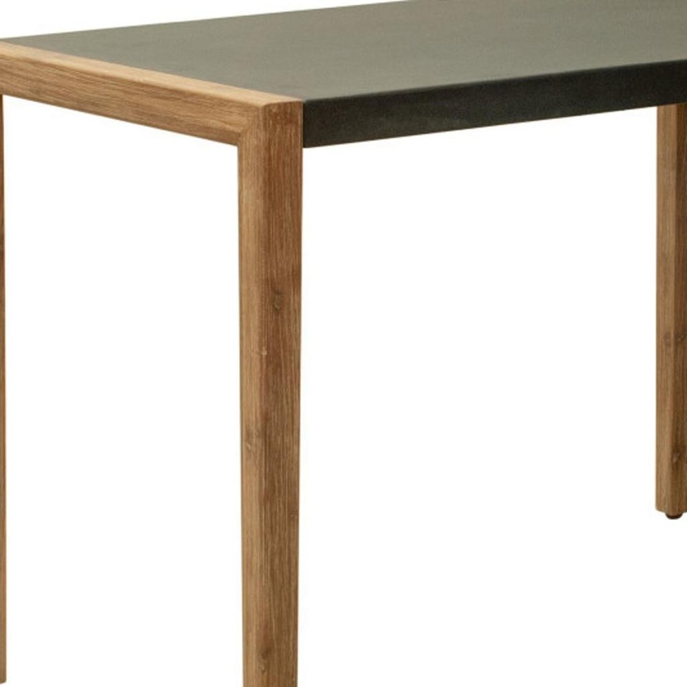 A close-up of a bar table with a gray faux concrete top and natural wood legs against a white background.