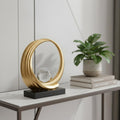 11" Gold Crystal Hand Painted Abstract, Crystal Ball Crystal styled in a furnished interior with a light gray wall on a tiled floor.