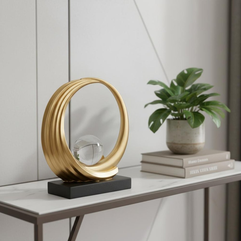 11" Gold Crystal Hand Painted Abstract, Crystal Ball Crystal styled in a furnished interior with a light gray wall on a tiled floor.