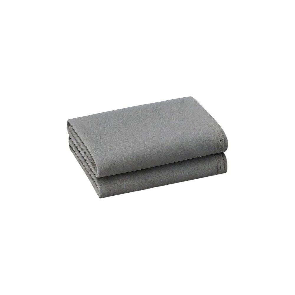 Two folded light gray cotton king pillowcases on a white background.