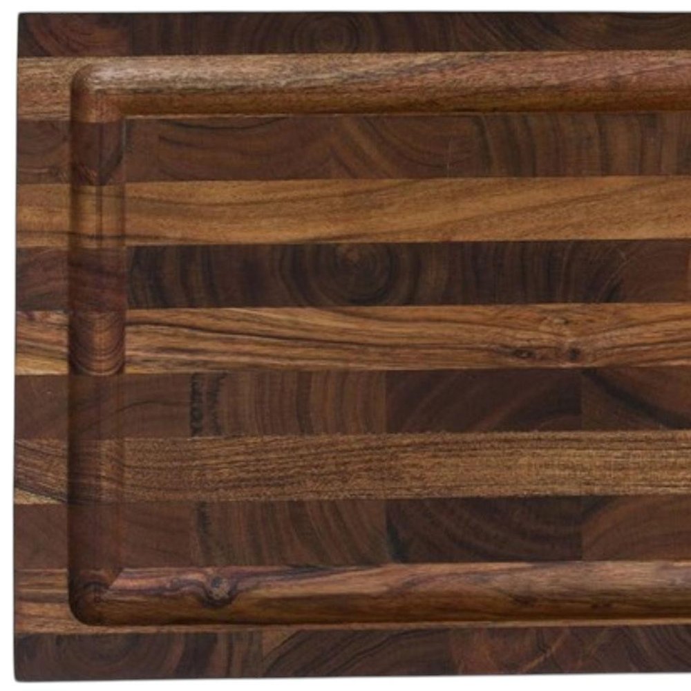 16" Brown Solid Wood Cutting Board With Juice Groove close-up highlighting the brown wood surface.