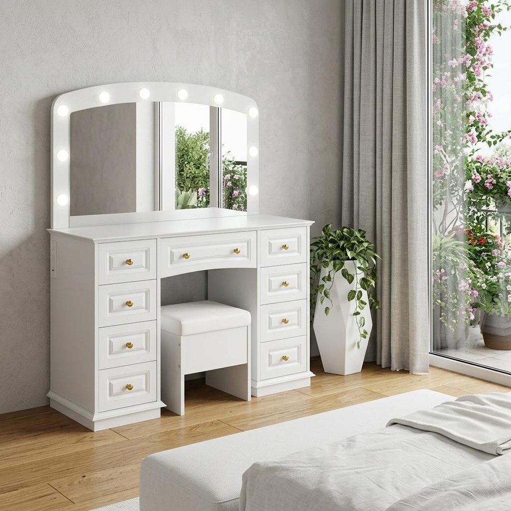 43" White Wood Mirrored Nine Drawer Vanity Table And Lights styled in a furnished interior with a light gray wall on a off-white floor.