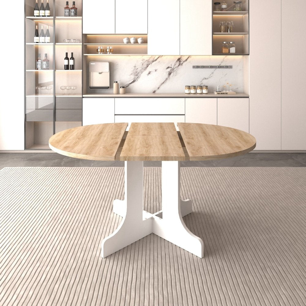 Oval wood coffee table with white cross legs on a striped rug in a modern kitchen.
