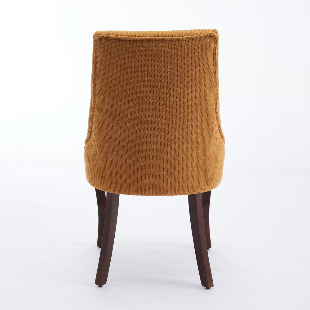 Back view of a brown linen dining chair with dark wood legs on a white background.