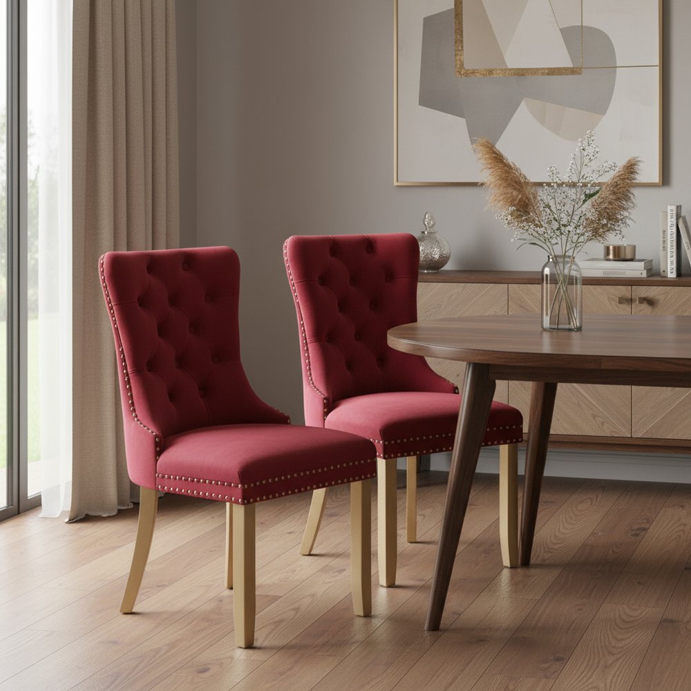 Set of Two Red and Gold Tufted Velvet And Solid Wood Dining Side Chairs in a home interior