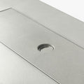 Close-up of 50000 BTU 42" Gray Steel Propane Rectangular Fire Pit With Cover showing the gray metal texture.