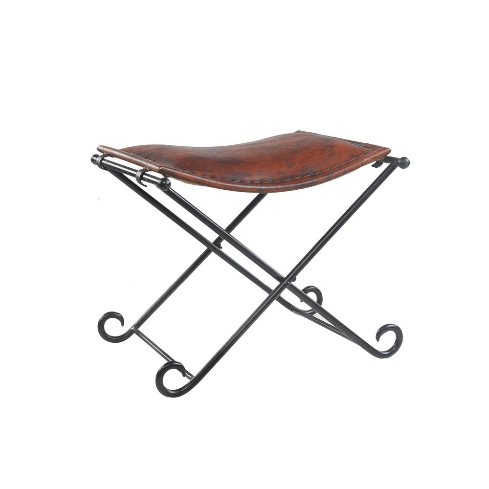 Brown leather and black metal folding stool with ornate legs on a white background.