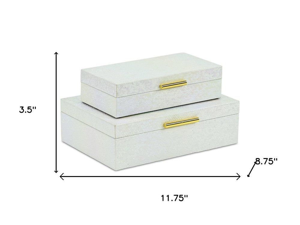 Set of Two White And Gold Faux Shagreen Nesting Storage Boxes With Lids on a white background
