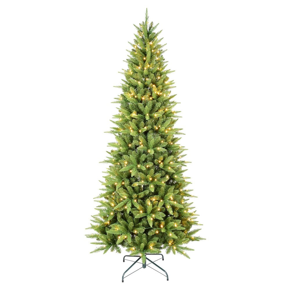 A tall, slender, pre-lit artificial pine Christmas tree with warm white lights on a white background.