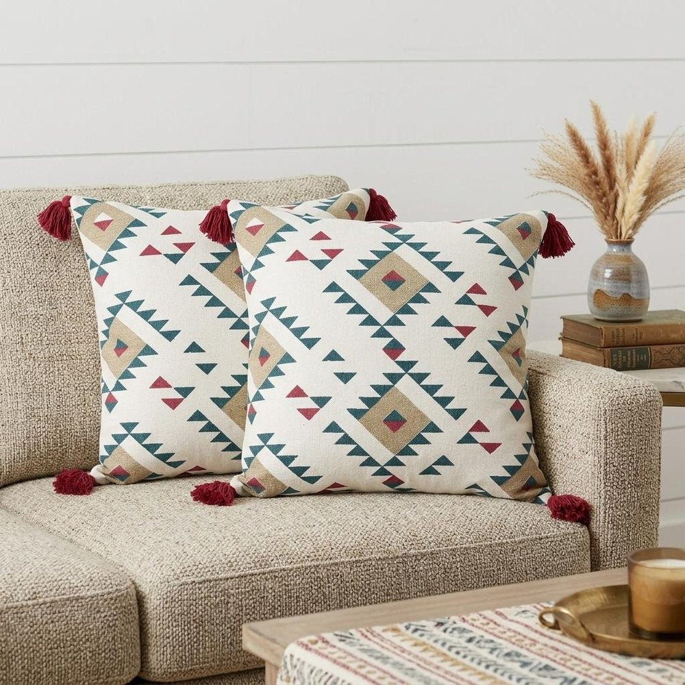 Set of Two 20" White Teal Blue Tan And Crimson Geometric Cotton Throw Pillows in a home interior