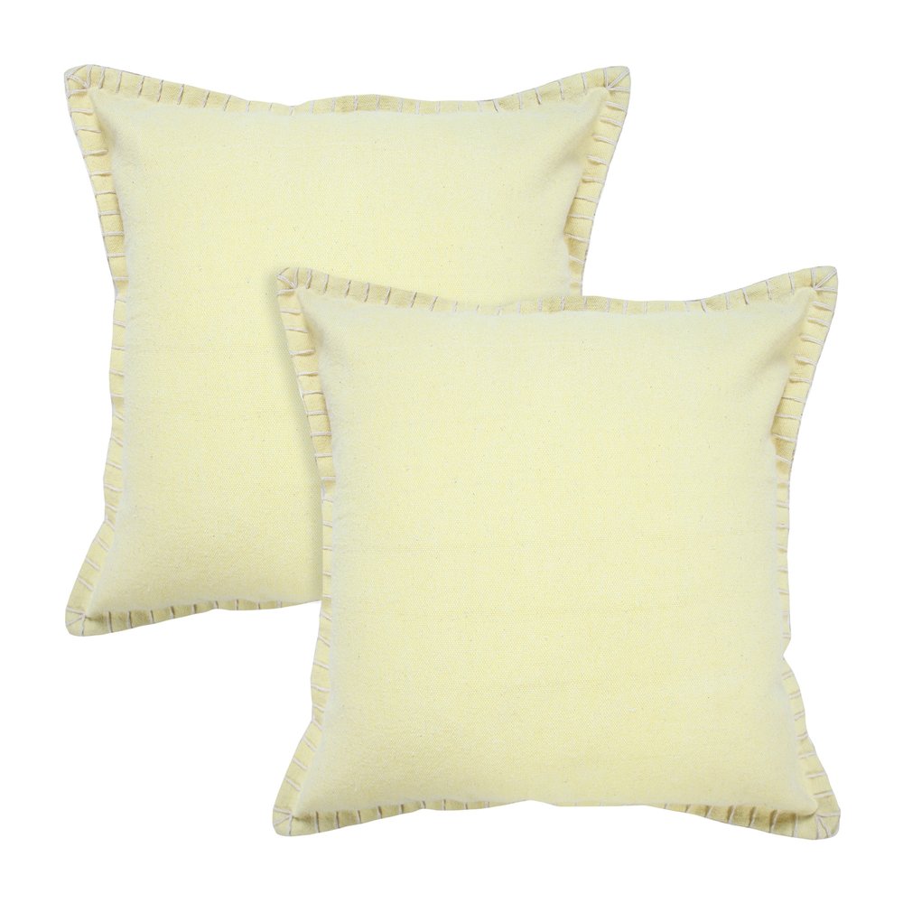 Two light yellow cotton throw pillows with decorative stitching on a white background.