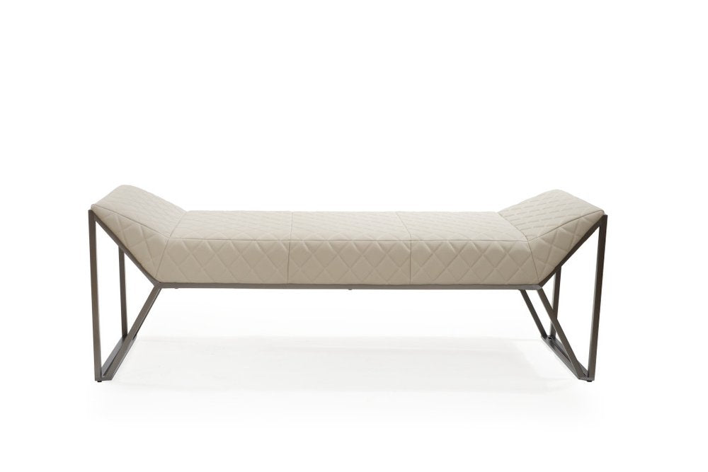 A cream quilted faux leather upholstered bench with a gray steel frame on a white background.